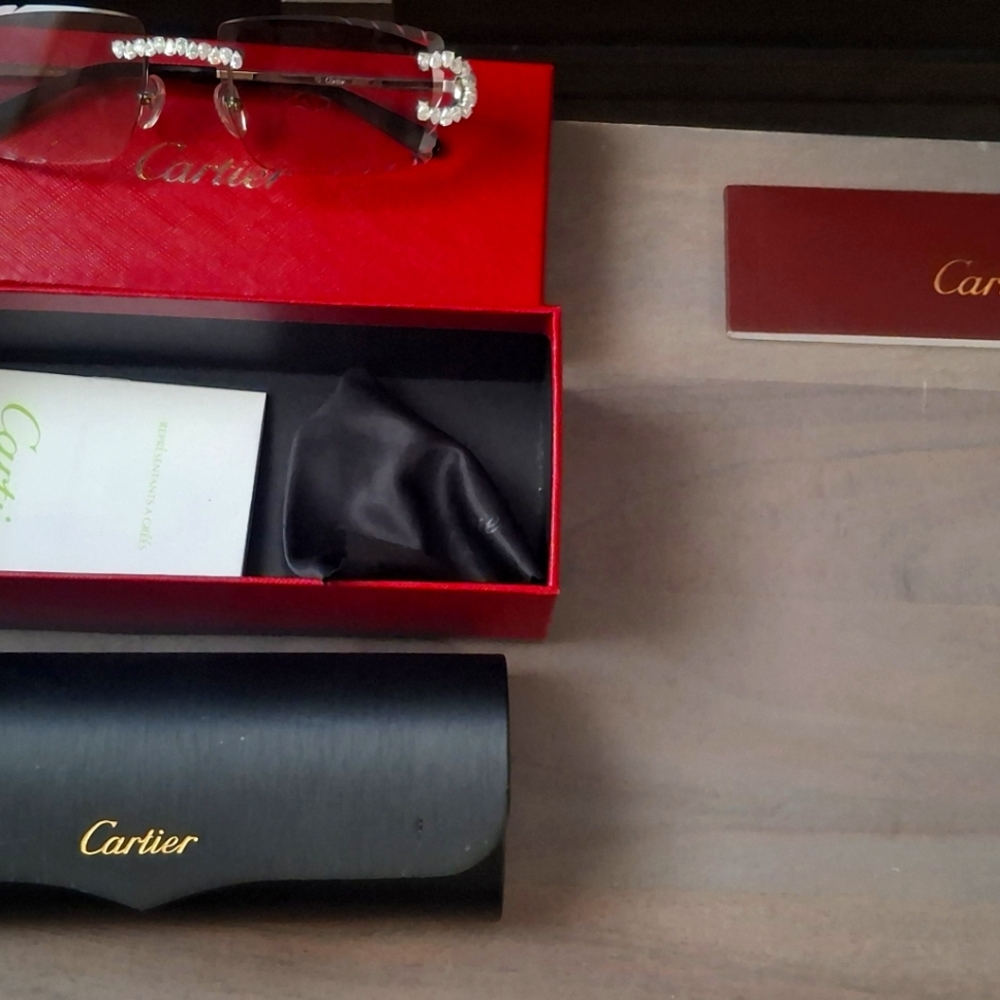 Cartier Rimless Glasses with Red and Black Accessories